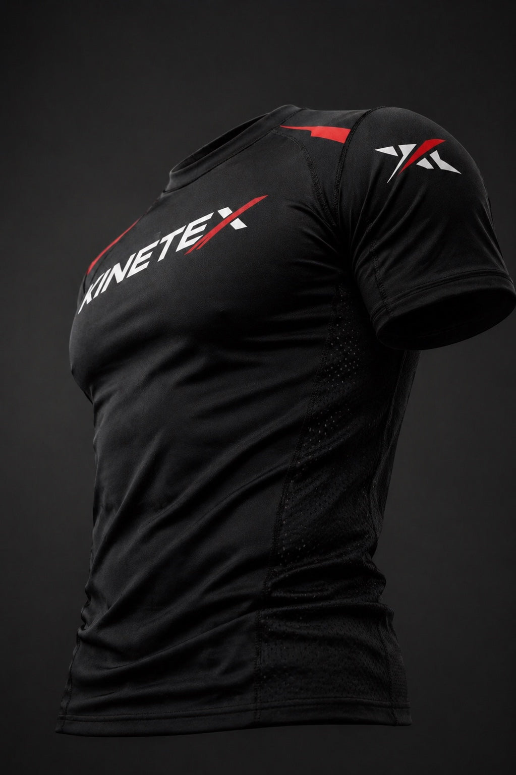 Kinetex black short-sleeve compression rash guard with red and white Kinetex logo on chest and shoulder.