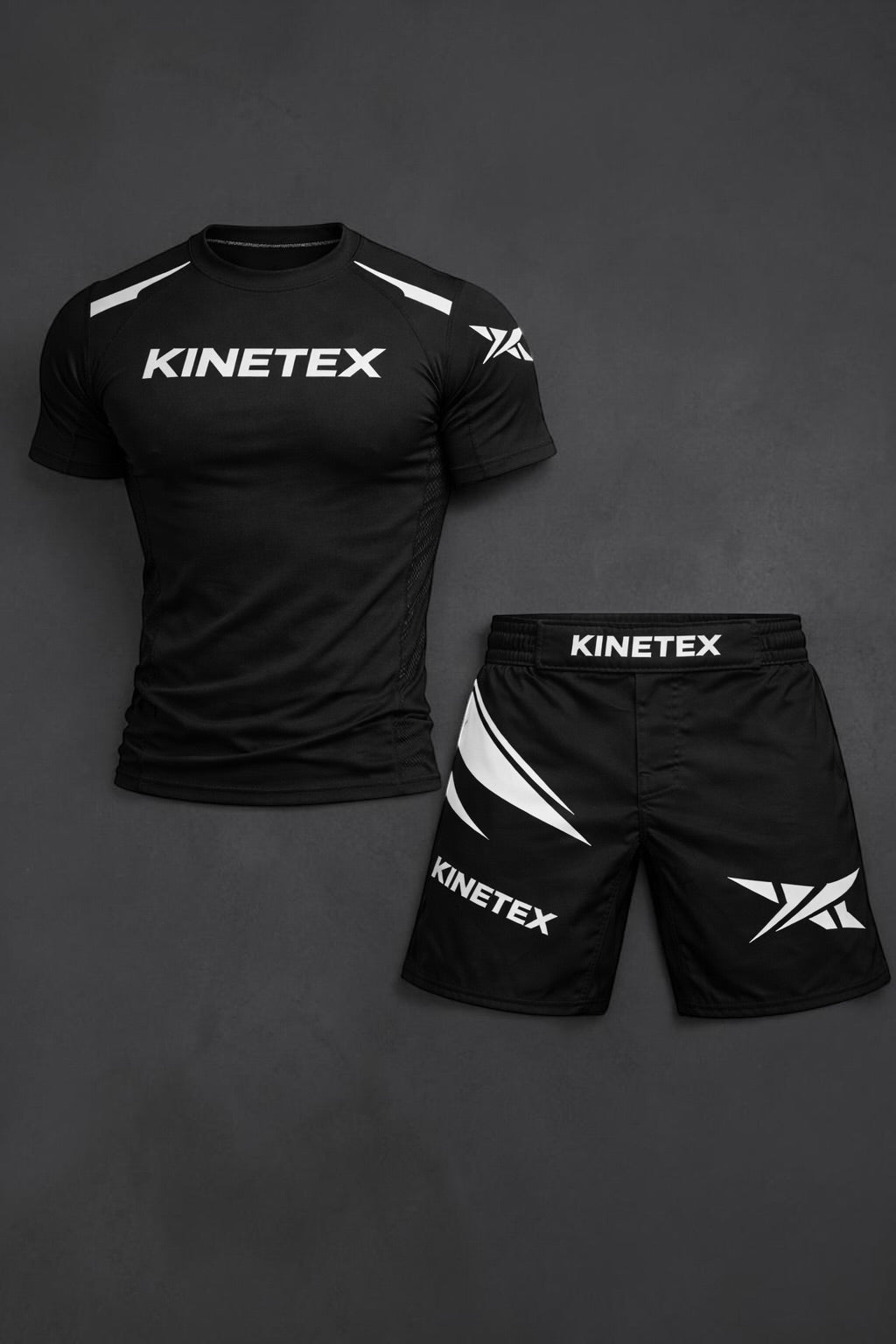 Kinetex black MMA combat pro set with compression rash guard and shorts featuring white Kinetex branding and graphic accents.
