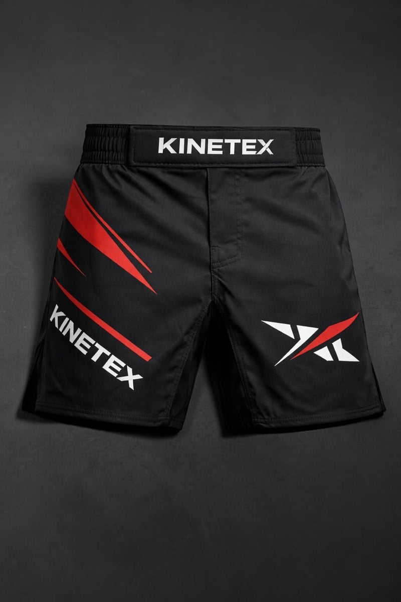 Kinetex black MMA combat shorts with red and white graphic accents and Kinetex logo.