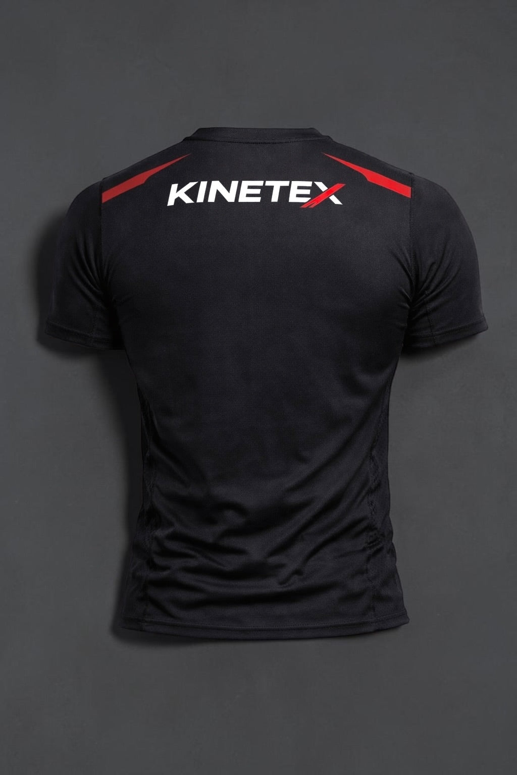 Kinetex black performance compression rash guard with red accents and white logo on back, designed for MMA.