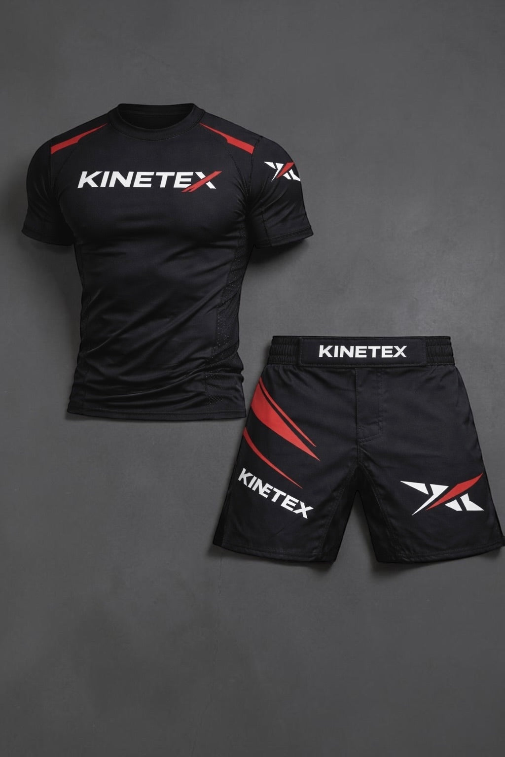 Kinetex black MMA compression rash guard with red accents and white logo, paired with black MMA shorts with red accents and Kinetex branding.
