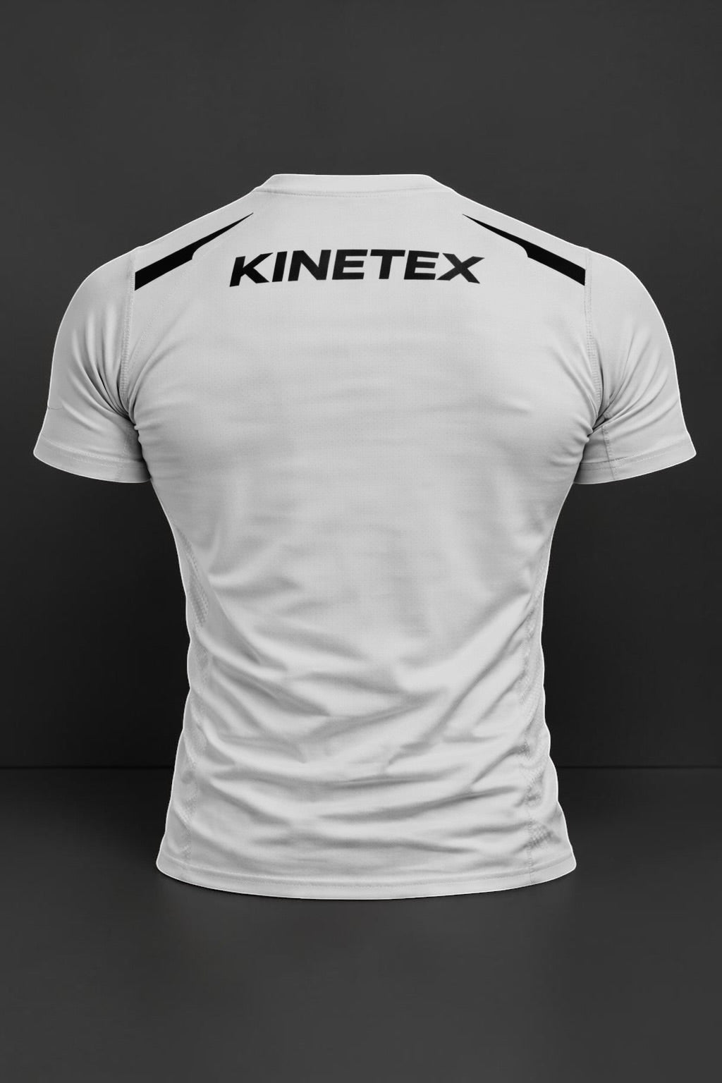 Kinetex Combat Pro white short-sleeve rash guard with black Kinetex logo on back. Compression fit for athletic performance.