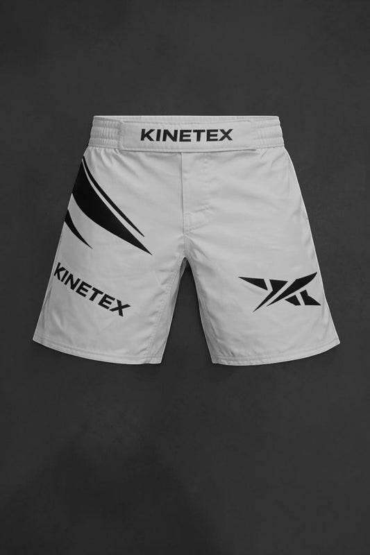 Kinetex white MMA combat shorts with black graphic accents and Kinetex logo on waistband and leg.
