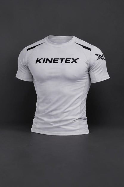 Kinetex KX Combat Pro MMA set: white short-sleeve compression rash guard with black Kinetex logo and accents.